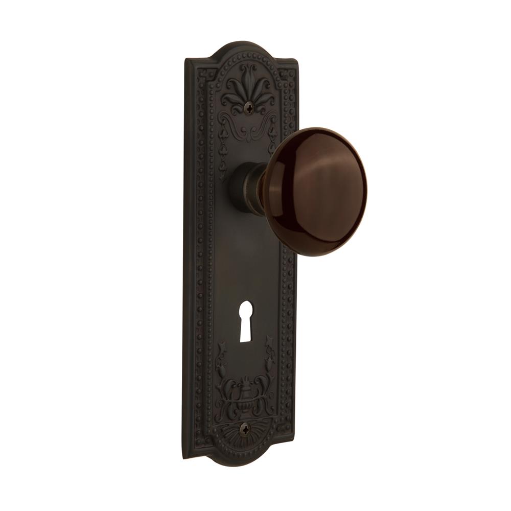 Nostalgic Warehouse MEABRN Mortise Meadows Plate with Brown Porcelain Knob with Keyhole in Oil Rubbed Bronze